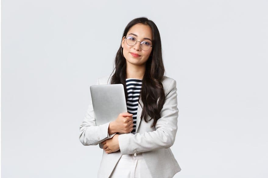 Asian HR consultant holding a laptop